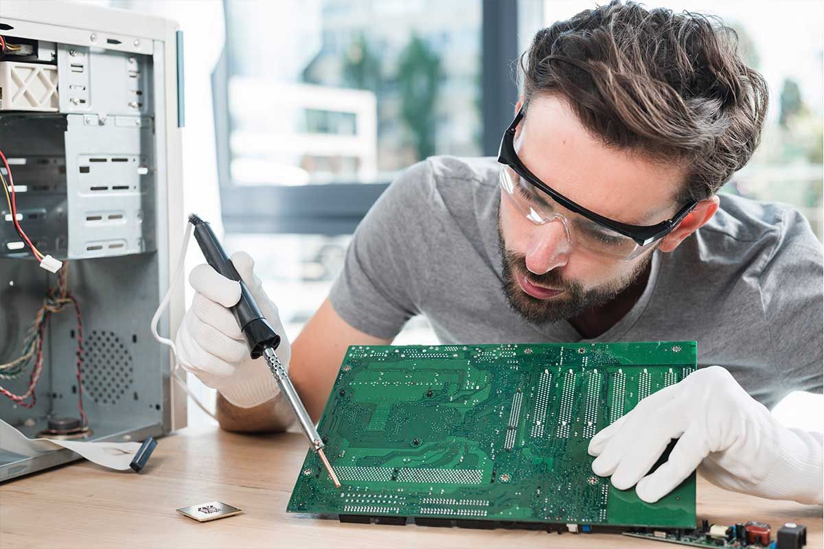 Technician repairing a desktop computer